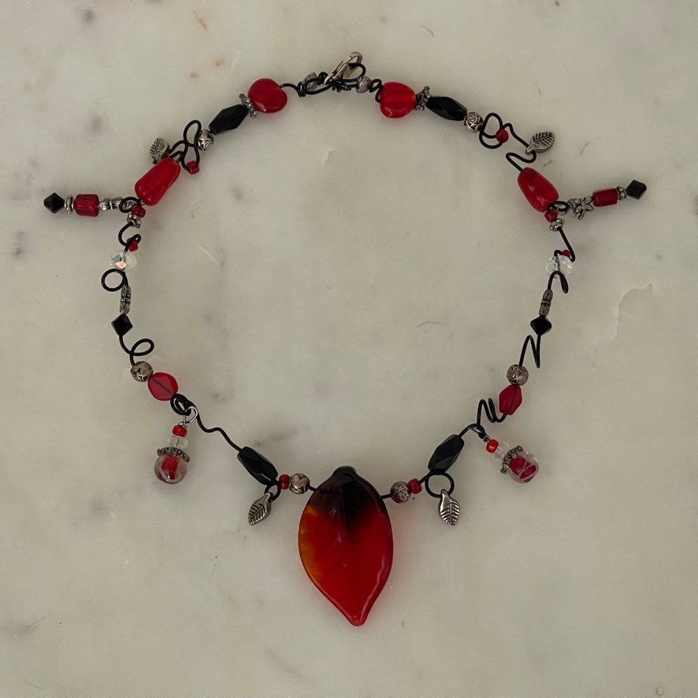 Black colored copper wire necklace.